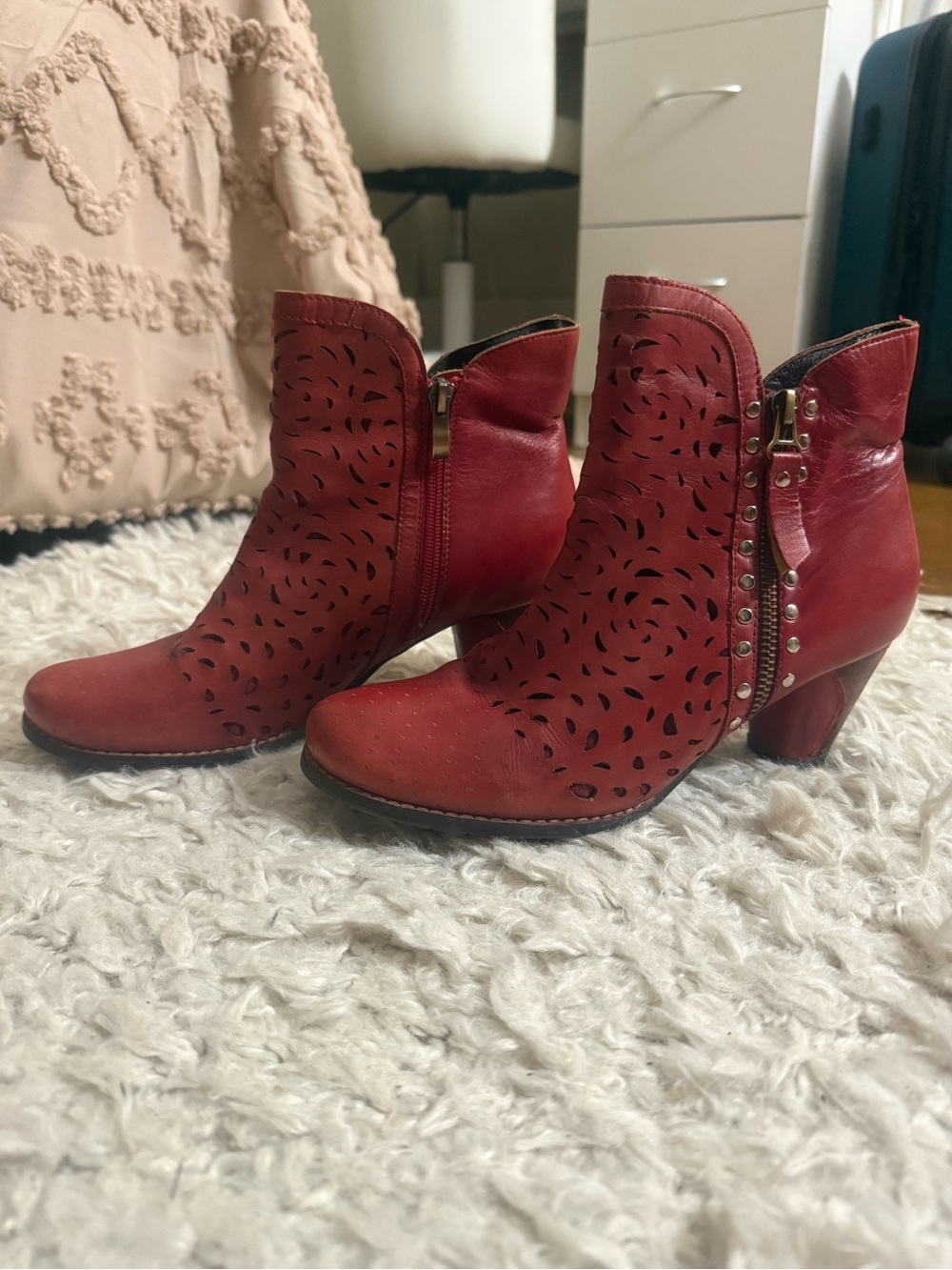 L’ARTISTE Red Perforated Leather Ankle Booties with Side Studs
